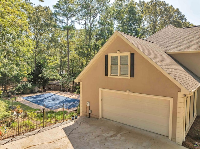 garage featuring fence