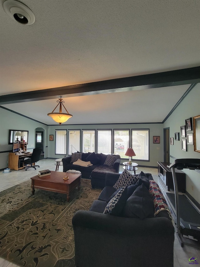 living room featuring arched walkways, vaulted ceiling with beams, and a textured ceiling