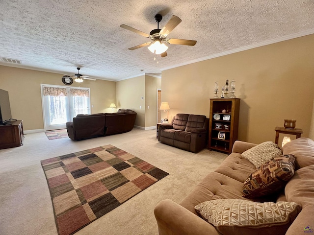 living room with carpet, visible vents, baseboards, and ornamental molding