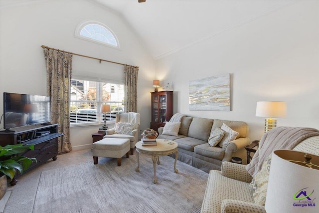 living area with carpet floors and high vaulted ceiling