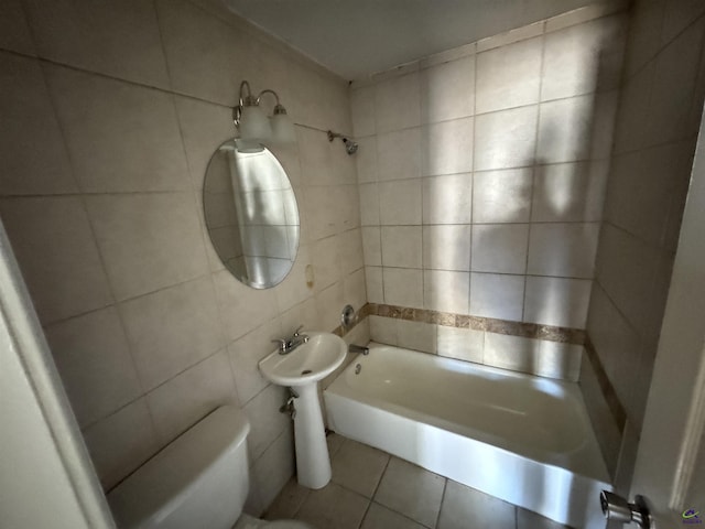 bathroom with  shower combination, tile walls, toilet, and tile patterned floors