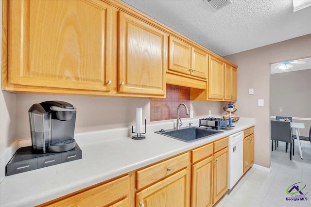 210 Cumberland Woods Ter, Warner Robins, GA 31088 - kitchen with visible vents, white dishwasher, light countertops, a textured ceiling, and a sink