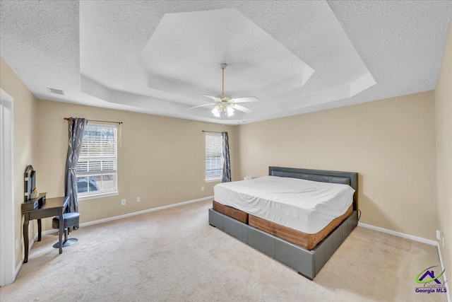 210 Cumberland Woods Ter, Warner Robins, GA 31088 - bedroom with a tray ceiling, multiple windows, and visible vents