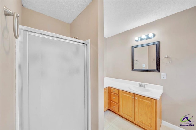 210 Cumberland Woods Ter, Warner Robins, GA 31088 - bathroom featuring a textured ceiling, a shower stall, and vanity