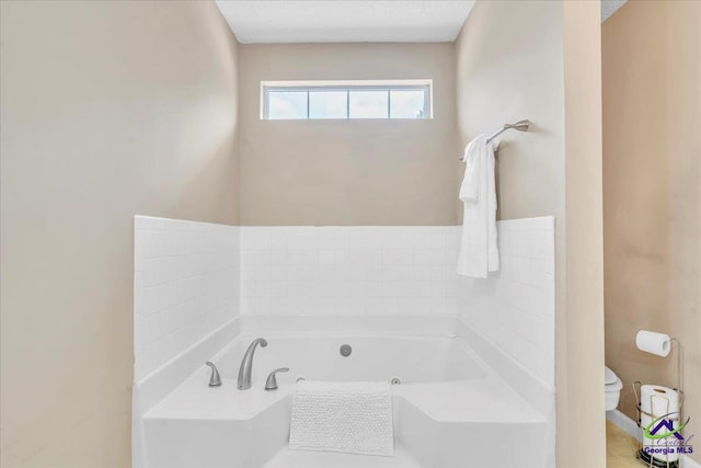 210 Cumberland Woods Ter, Warner Robins, GA 31088 - full bath with toilet, a textured ceiling, and a bath
