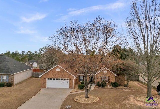 210 Cumberland Woods Ter, Warner Robins, GA 31088 - ranch-style home featuring a garage, concrete driveway, brick siding, and fence