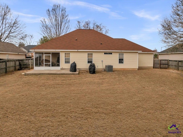 210 Cumberland Woods Ter, Warner Robins, GA 31088 - back of property featuring a sunroom, a fenced backyard, cooling unit, and a patio