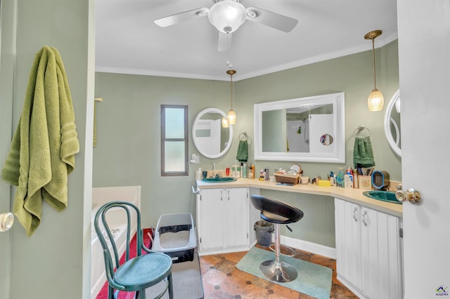 bathroom featuring a ceiling fan, crown molding, and double vanity