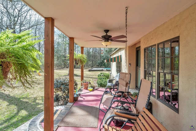 view of patio / terrace featuring ceiling fan