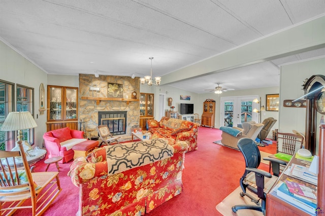 living area with carpet floors, french doors, a fireplace, ornamental molding, and a textured ceiling