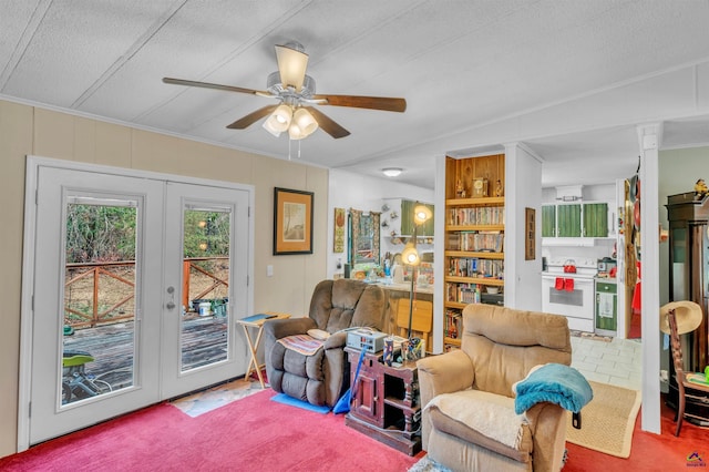 living area with carpet, ceiling fan, and french doors