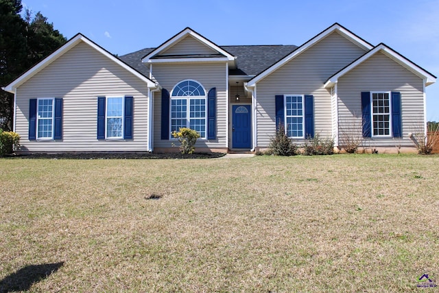 ranch-style house with a front yard