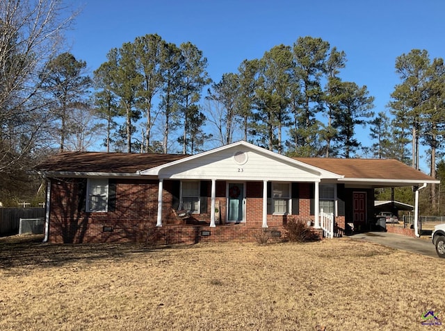 ranch-style home featuring crawl space, an attached carport, concrete driveway, and brick siding