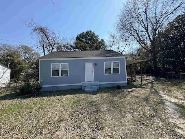 manufactured / mobile home featuring crawl space, a front yard, fence, and roof with shingles