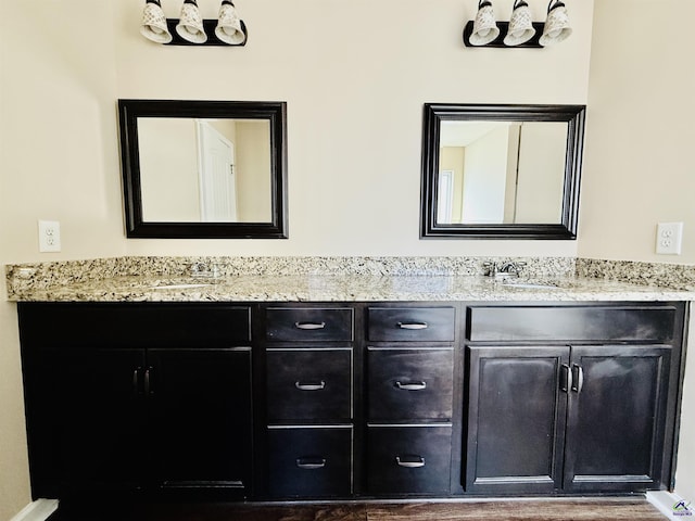 full bath with double vanity and a sink