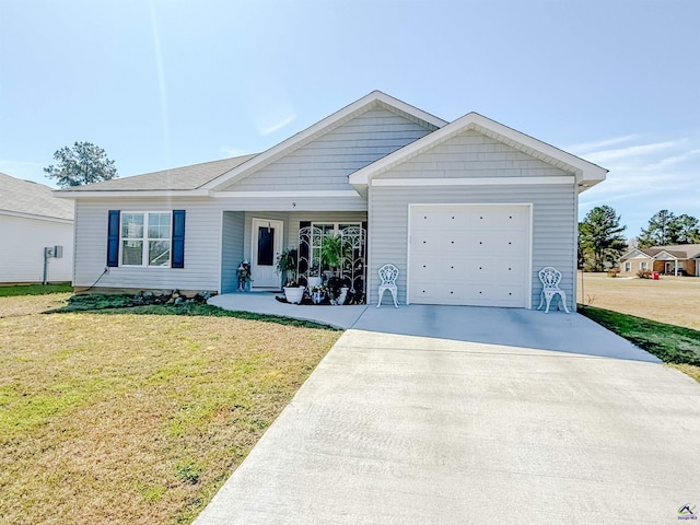 ranch-style home featuring a garage, driveway, and a front lawn