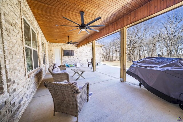 view of patio / terrace featuring area for grilling and a ceiling fan