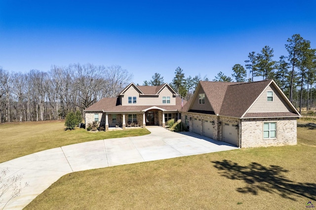 view of front of property with a garage, concrete driveway, a front lawn, and brick siding