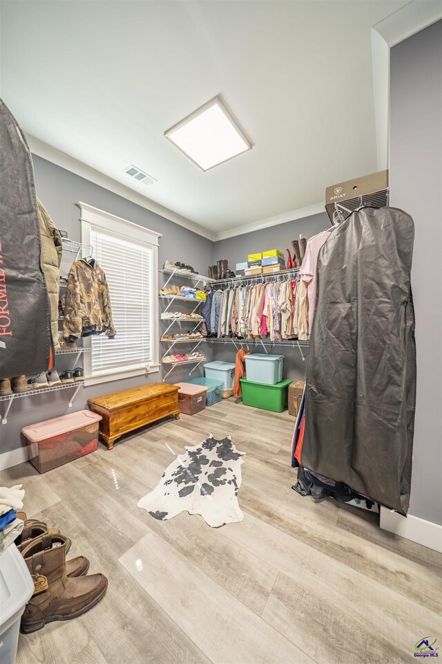 spacious closet with visible vents and wood finished floors