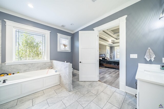 full bath with ornamental molding, vanity, ensuite bath, baseboards, and a bath