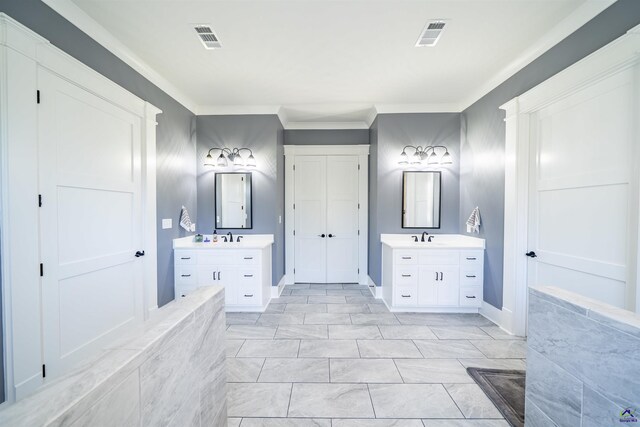 bathroom with a sink, two vanities, and visible vents