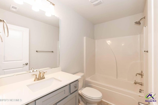 bathroom featuring washtub / shower combination, visible vents, vanity, and toilet