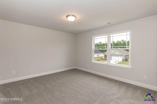 carpeted empty room with baseboards and visible vents