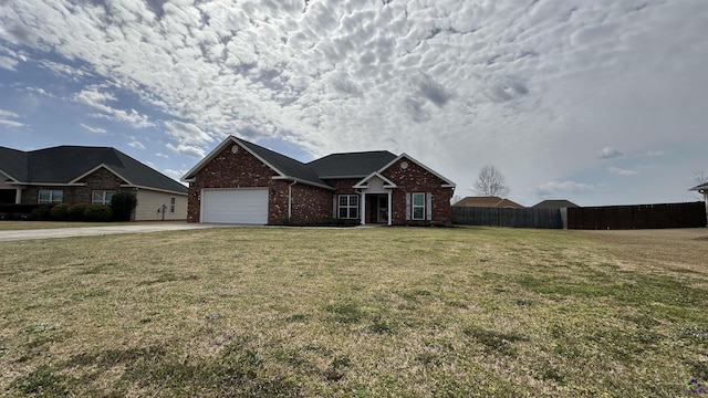 view of front of property with brick siding, fence, a garage, driveway, and a front lawn