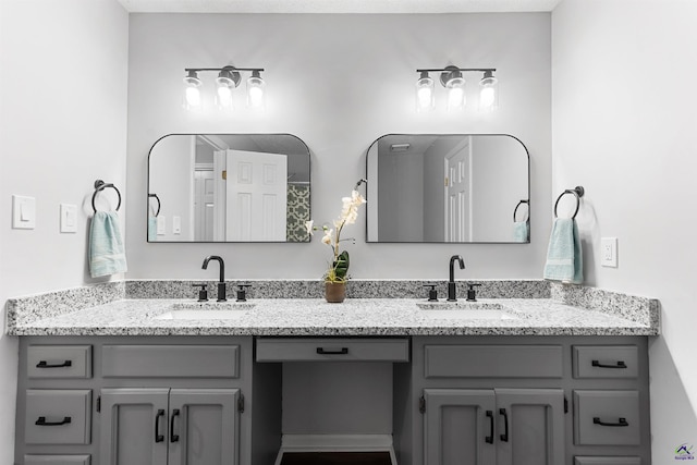 full bath featuring a sink and double vanity