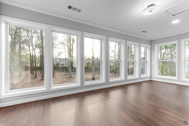 unfurnished sunroom with visible vents