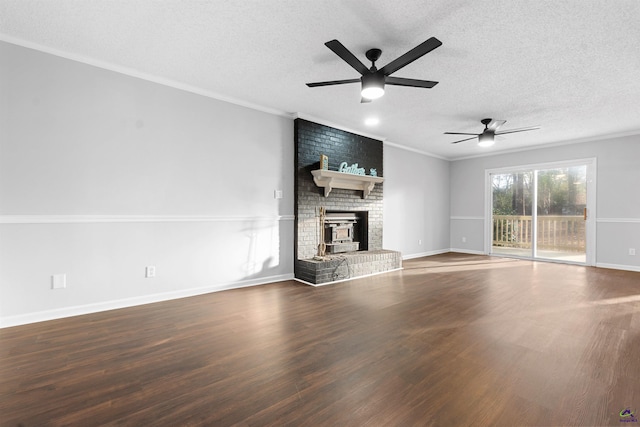 unfurnished living room featuring crown molding, a textured ceiling, and wood finished floors