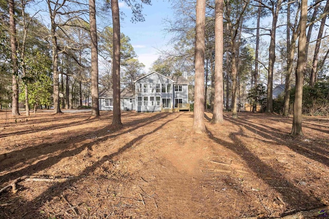view of front of house with a sunroom
