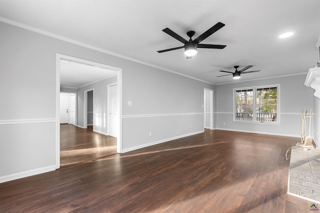 unfurnished living room featuring ornamental molding, dark wood finished floors, and baseboards