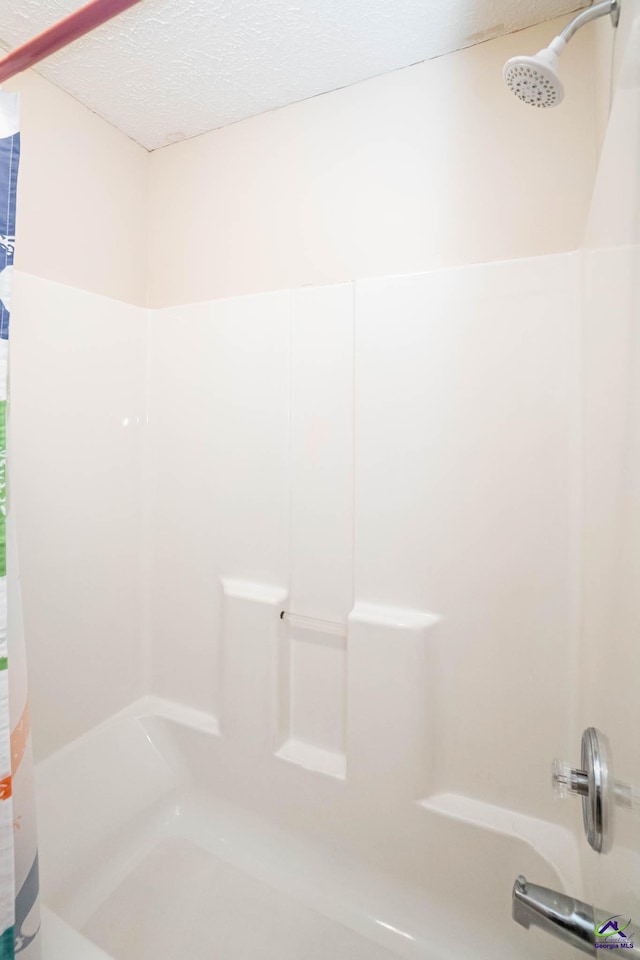 bathroom featuring a textured ceiling