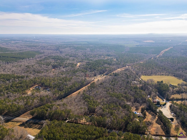 drone / aerial view featuring a view of trees