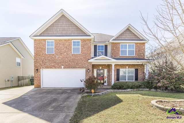 view of front facade featuring a front lawn, driveway, fence, a garage, and brick siding