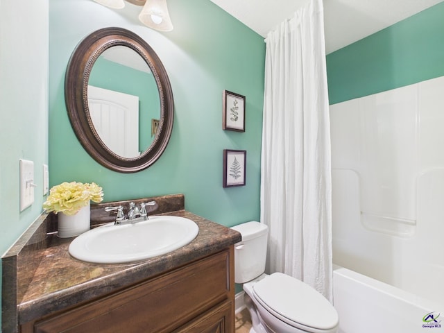 bathroom with shower / bath combo with shower curtain, toilet, and vanity