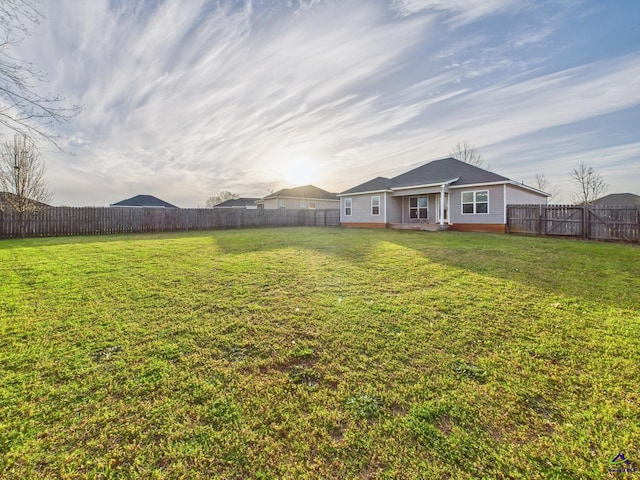 view of yard with a fenced backyard