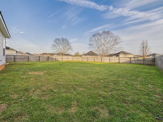 view of yard with a fenced backyard