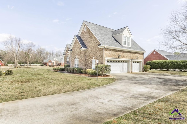 view of side of property featuring brick siding, driveway, a shingled roof, and a yard