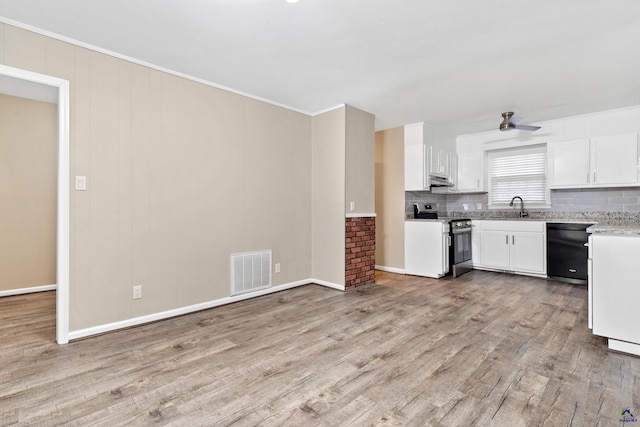 kitchen with visible vents, a sink, black dishwasher, stainless steel range with electric cooktop, and light wood finished floors