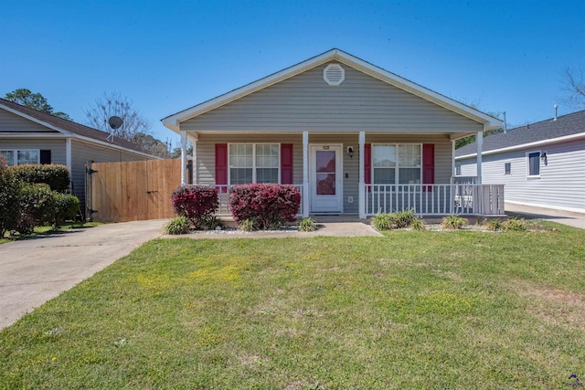 view of front of house featuring a porch, a front yard, and a gate