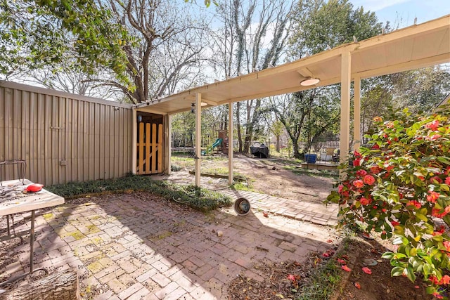 view of patio / terrace featuring fence