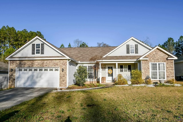 view of front of house with concrete driveway, a porch, and a front lawn