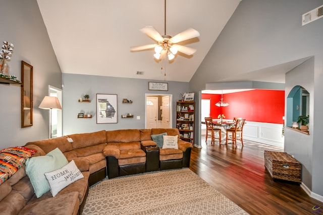 living area featuring high vaulted ceiling, wood finished floors, visible vents, and ceiling fan