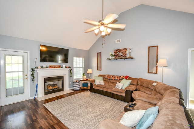 living area with ceiling fan, baseboards, a fireplace with flush hearth, and dark wood-style floors