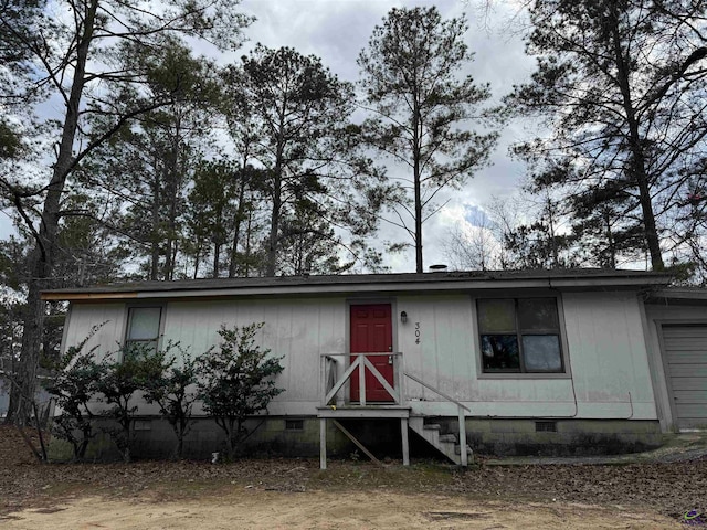 view of front of home with a garage and crawl space