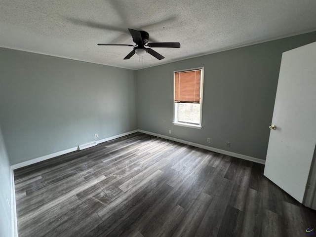 unfurnished room featuring a ceiling fan, baseboards, visible vents, dark wood-type flooring, and a textured ceiling