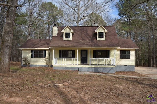 cape cod-style house featuring a porch, a chimney, and crawl space