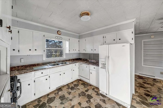 kitchen featuring white appliances, stone finish floor, crown molding, and a sink